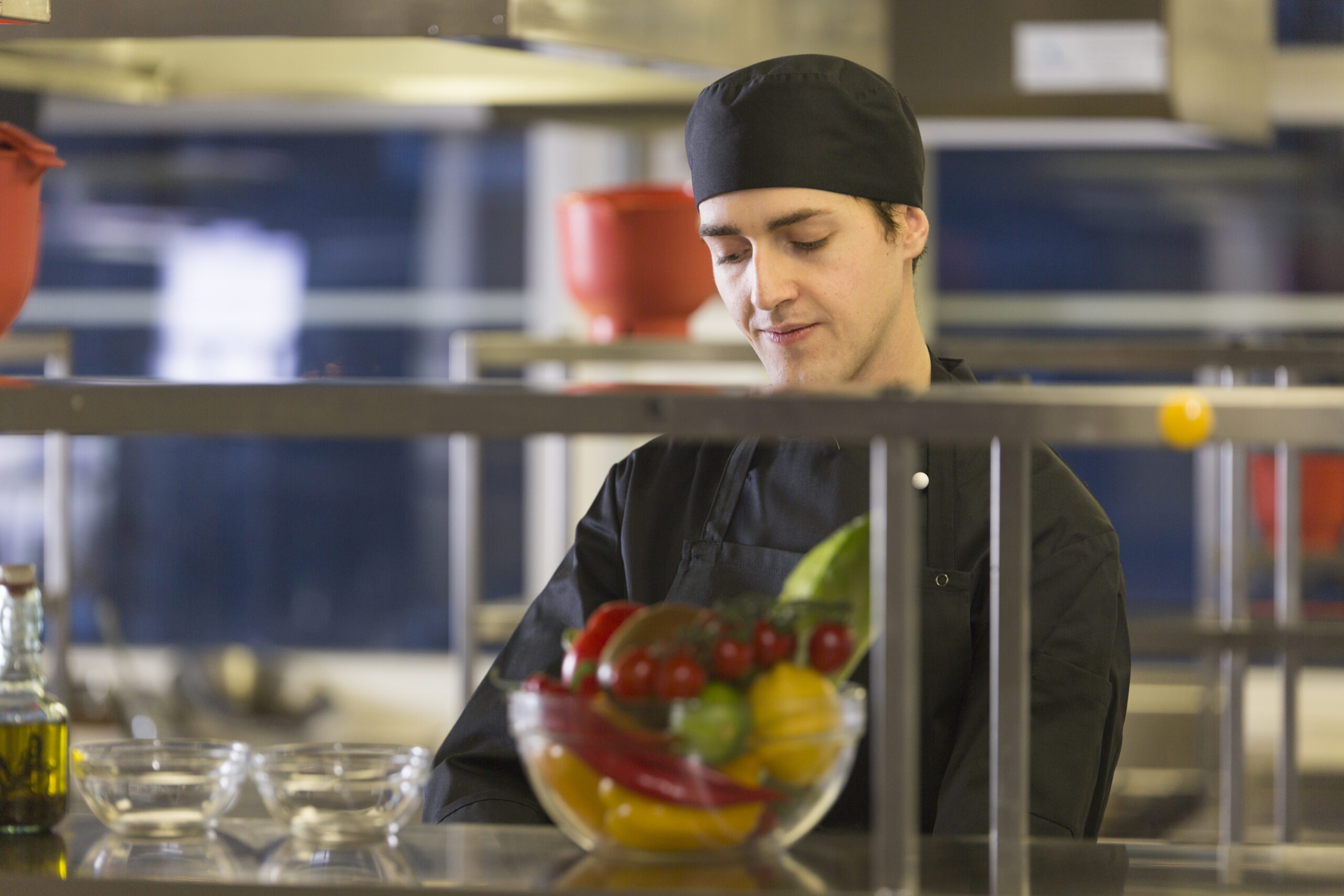 Chef preparing recipe behind a counter to serve