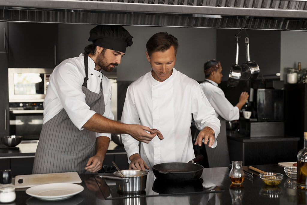 Two chefs are training and upskilling in their hospitality roles 