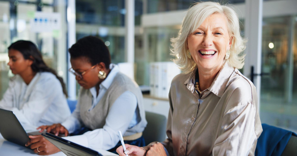 Group of women between the ages of 40-60 at work in an office