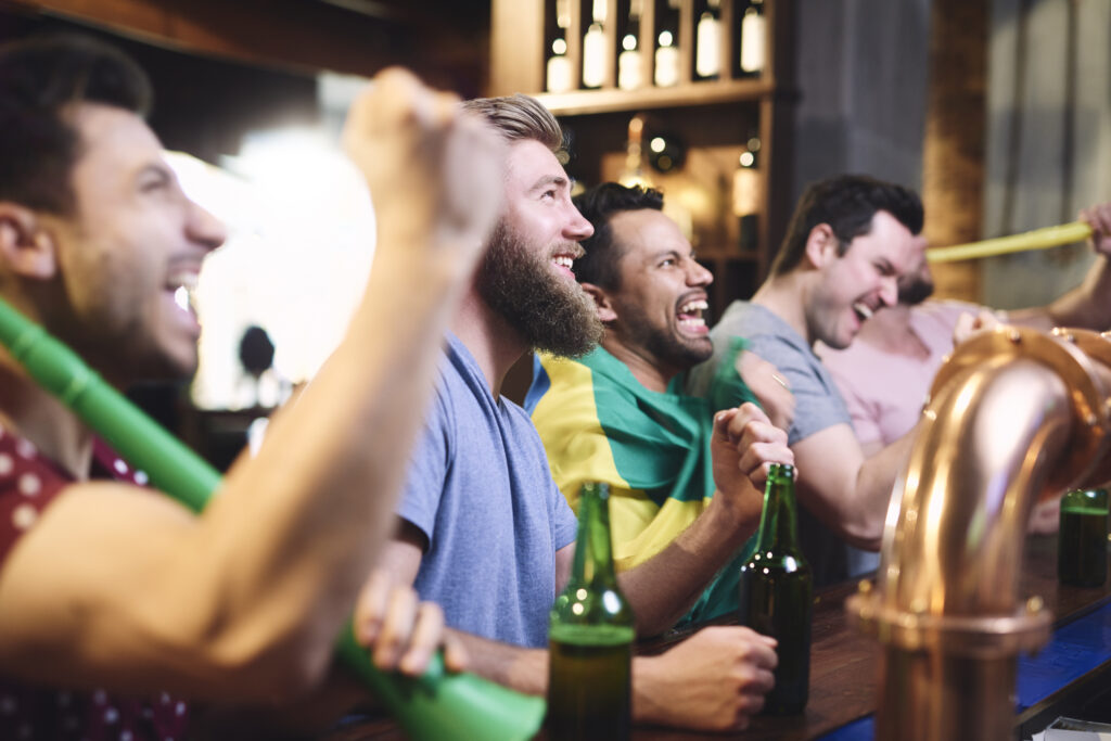Happy men while watching football